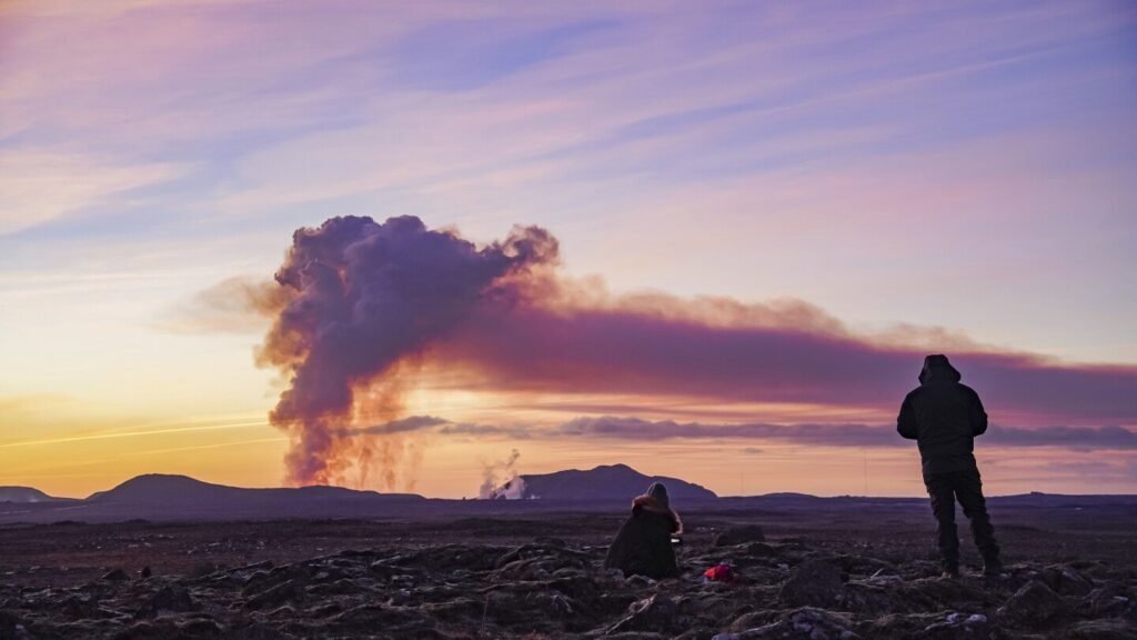 A volcano erupts in southwestern Iceland, sending lava flowing toward a nearby settlement