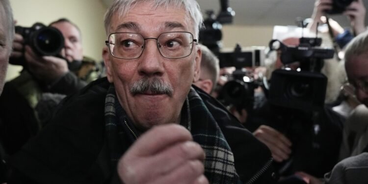 A Russian court sentences the co-chair of a Nobel-winning rights group to 30 months in prison