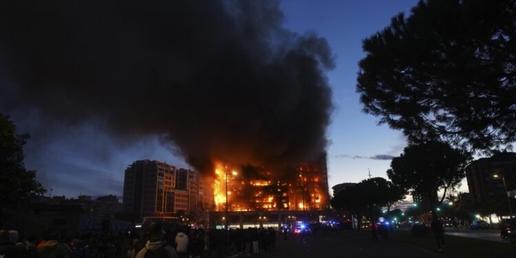 Fire engulfs 2 buildings in Spanish city of Valencia, killing at least 4 people. Nearly 20 missing