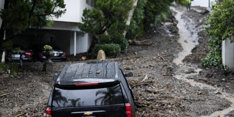 Historic storm sends debris through LA’s Hollywood Hills and leaves 1.1 million without power