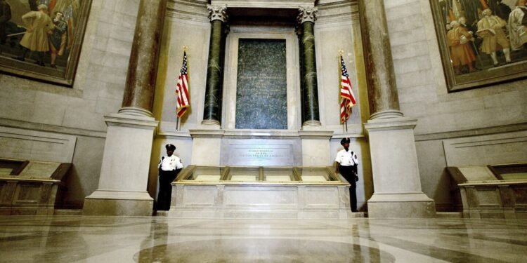 Protesters pour red powder on US Constitution enclosure, prompting evacuation of National Archives