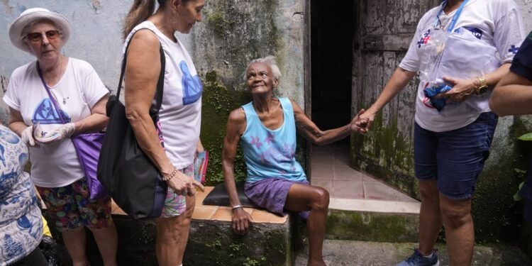 To fight dengue epidemic, health agents in Brazil scour junkyards and roofs for mosquitos