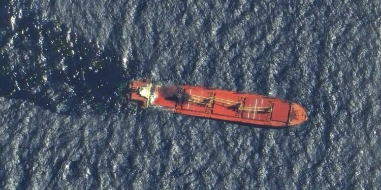 A ship earlier hit by Yemen’s Houthi rebels sinks in the Red Sea, the first vessel lost in conflict