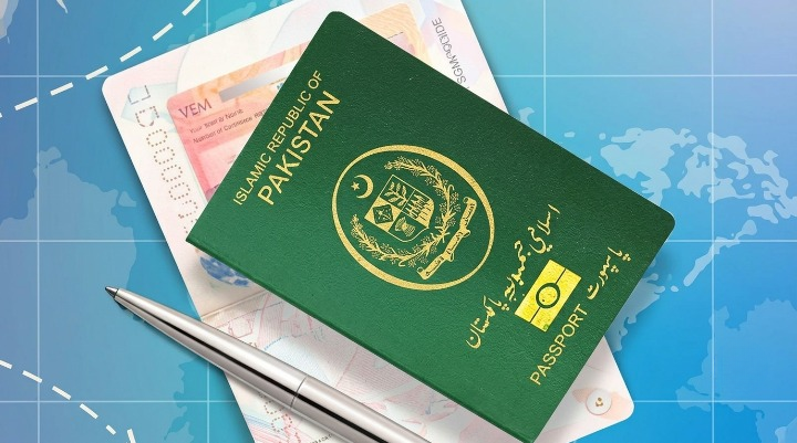 Are Physical Passports Ending in Pakistan With New E-Passport Shift? Green Pakistani passport with visa and pen